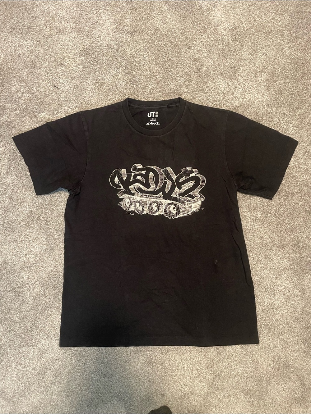 KAWS Black Tee with White Graffiti Tank Motif